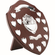 MAHOGANY SHIELD WITH CHROME FRONTS AND 13 RECORD SHIELDS (1in CENTRE) - 14in